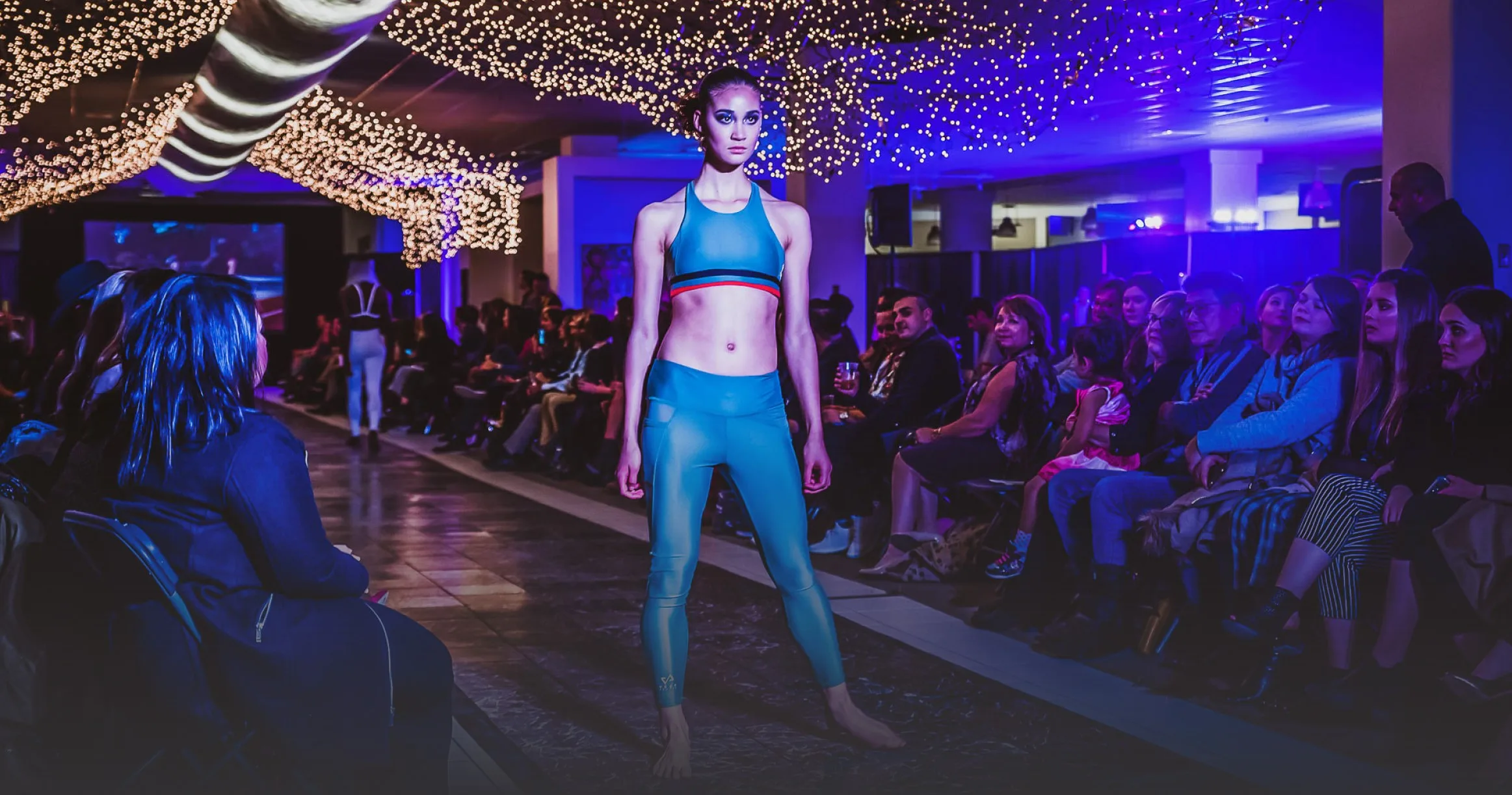 Audience watching a C-Tribe x Fashion runway show